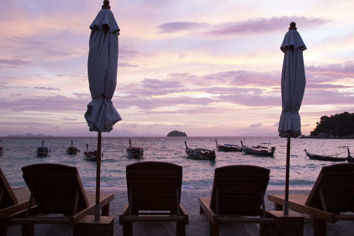 long tail boats on the beach